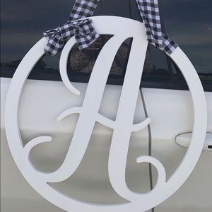 A sign with plaid ribbon